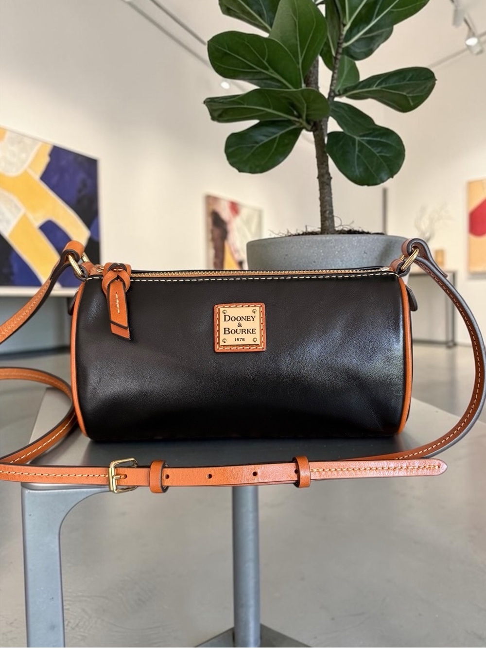 Dooney & Bourke Buffy Crossbody Black with Tan Trim Leather Barrel Crossbody - Picture 4 of 16